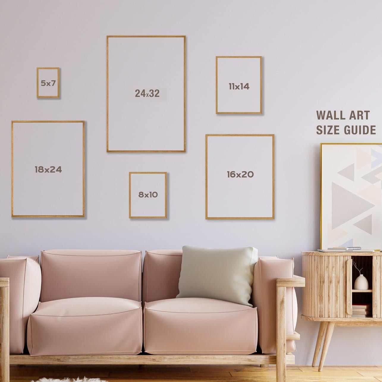 Living room with a beige sofa, wooden side table, and wall art size guide on a light gray wall.