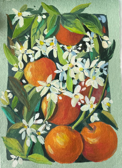 Artistic depiction of oranges and flowers on a small canvas with watercolor supplies in the background.
