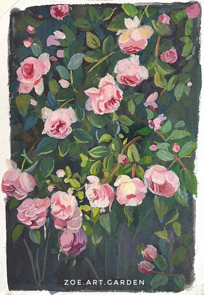 Floral painting with pink flowers on dark background, watercolor set, and brush in the background.