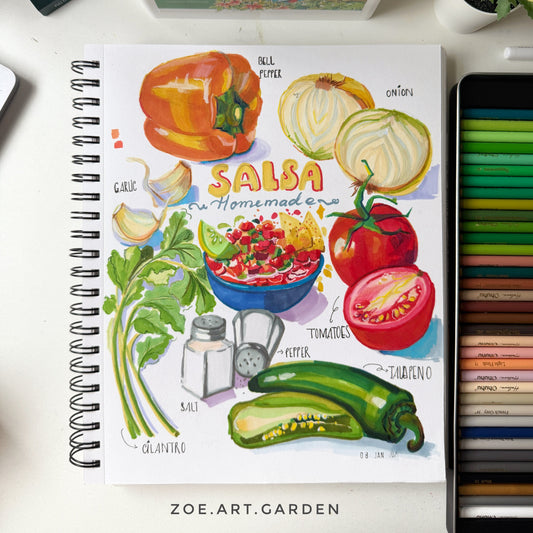 Notebook with salsa illustration surrounded by art supplies on a white surface