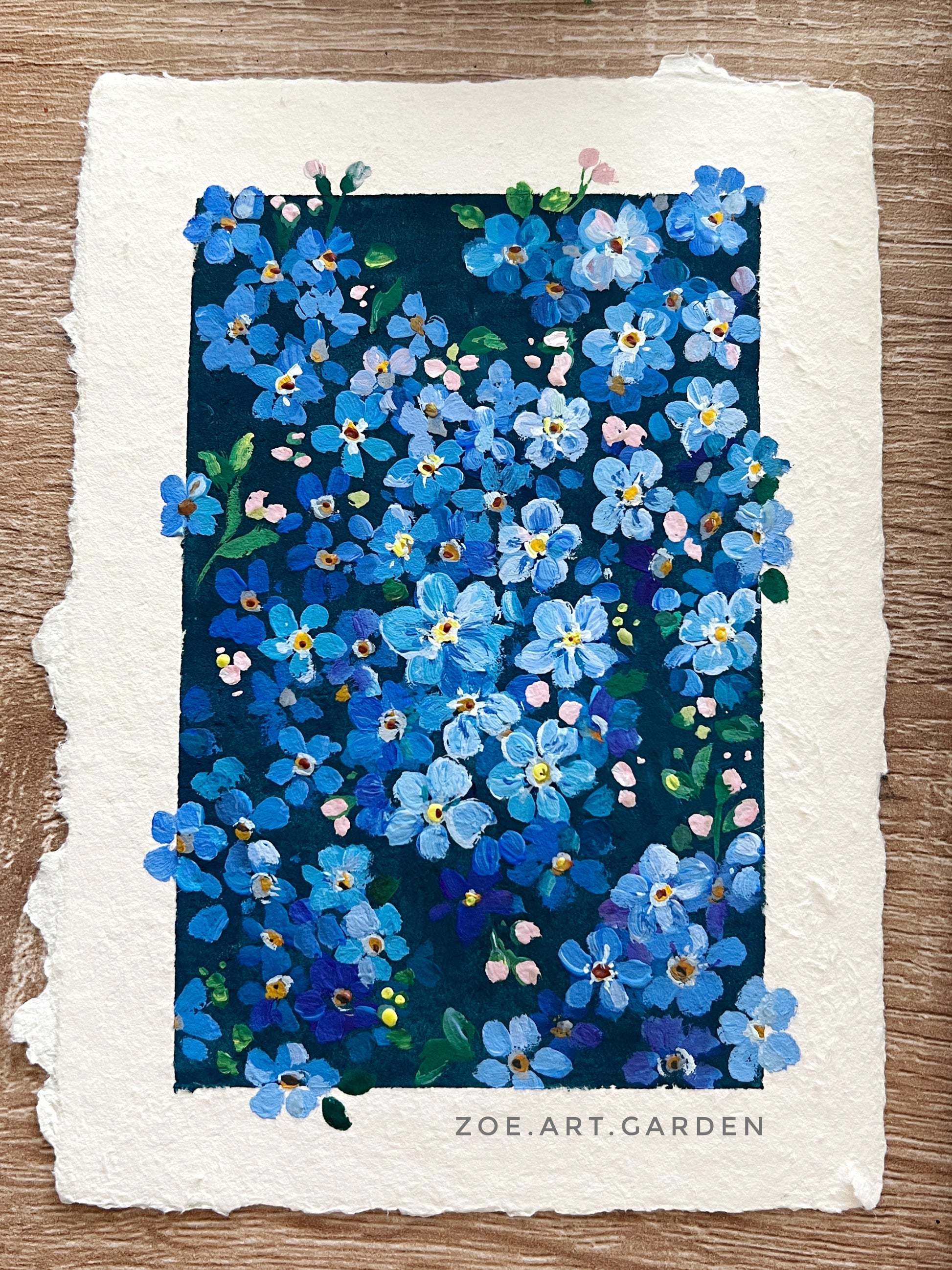 Artistic depiction of blue flowers on a textured paper background with 'Zoe Art Garden' branding.