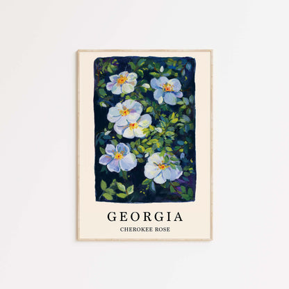 Framed artwork of blue flowers with green leaves on a white background