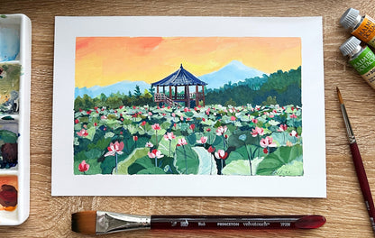 Art supplies including watercolor paints, a brush, and a completed watercolor painting of a landscape with a pagoda.