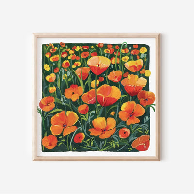 Framed artwork of orange flowers on a white background