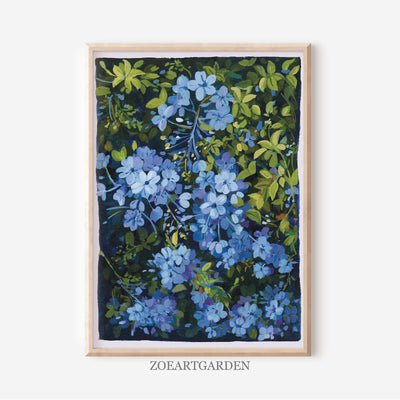 A framed botanical art print featuring blue flowers and green leaves on a dark background, displayed against a light gray wall with the brand name ZOEARTGARDEN printed below the frame.