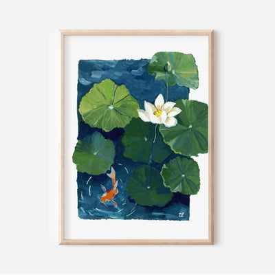 Framed artwork of a watercolor painting of a white lotus flower and green lily pads with a goldfish on a blue background.