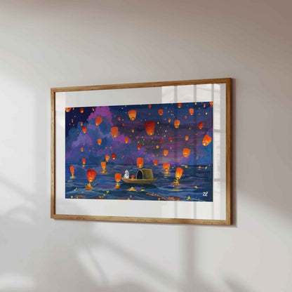 Framed artwork of a scene with colorful lanterns on a white wall