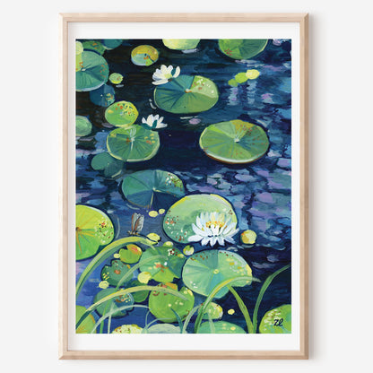 A framed art print depicting a serene pond scene with green lily pads, white water lilies, and dark blue water, presented in a light wood frame against a white wall.