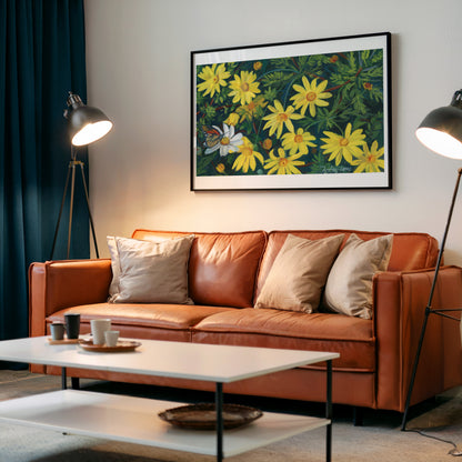 A framed floral art print featuring yellow daisies and a butterfly on a green background, displayed on a light gray wall above a brown leather sofa in a modern living room setting.